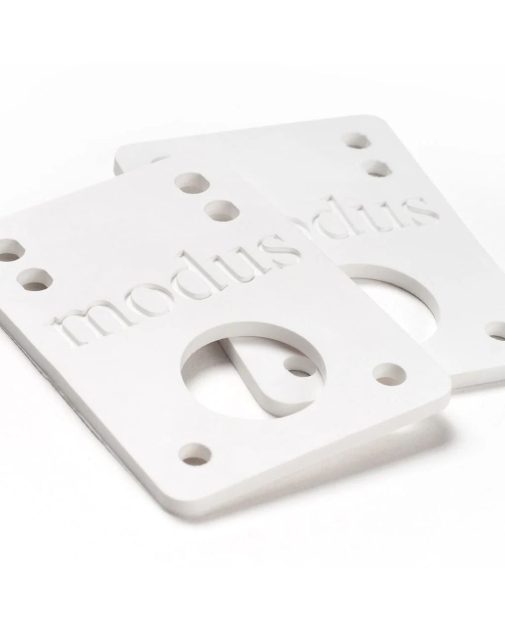 Modus Riser Pads in white – premium skateboard risers for trucks and decks, available at Richmond Surf & Skate.