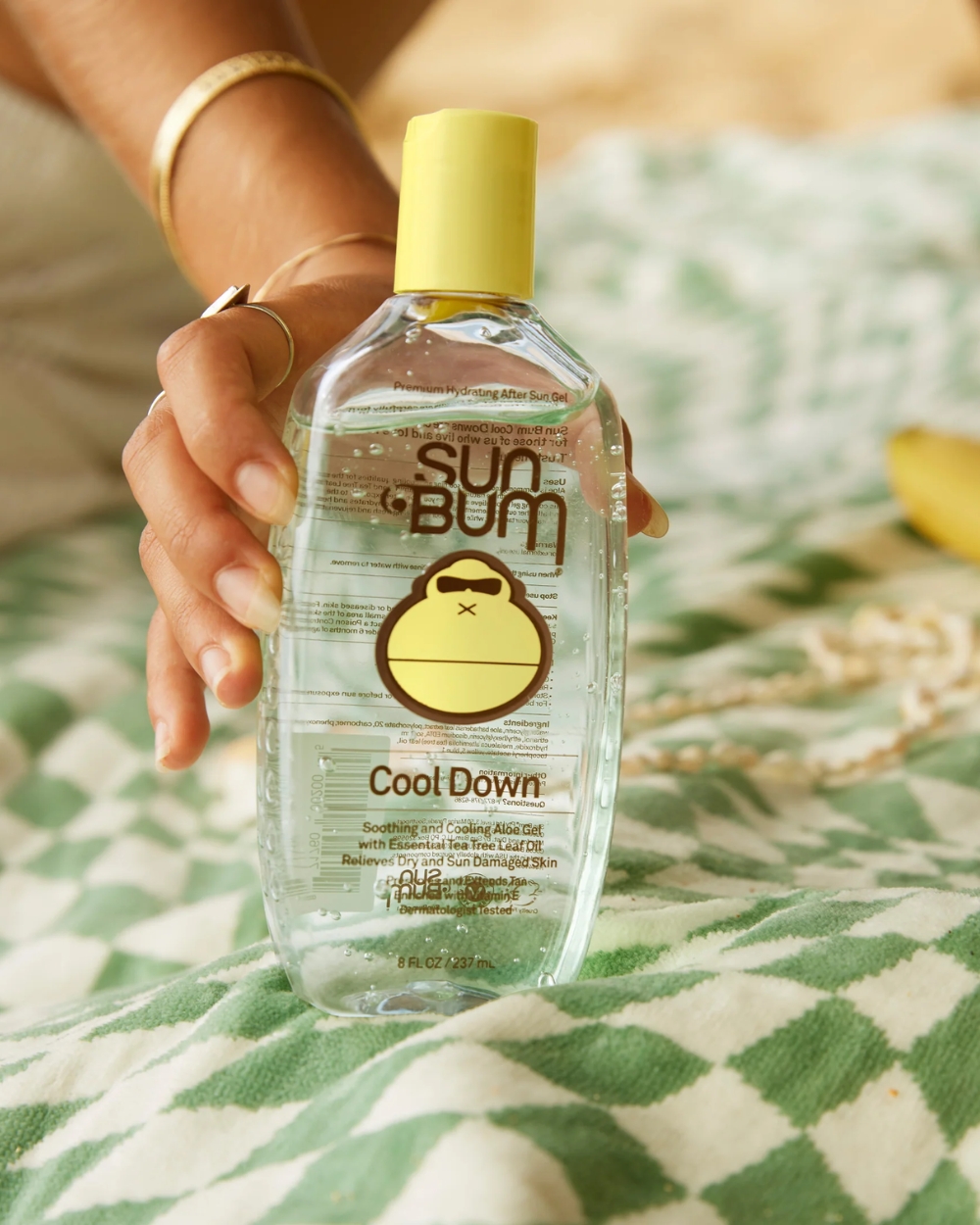 Sun Bum After Sun Cool Down Gel 237ml on beach towel – lifestyle beach photo