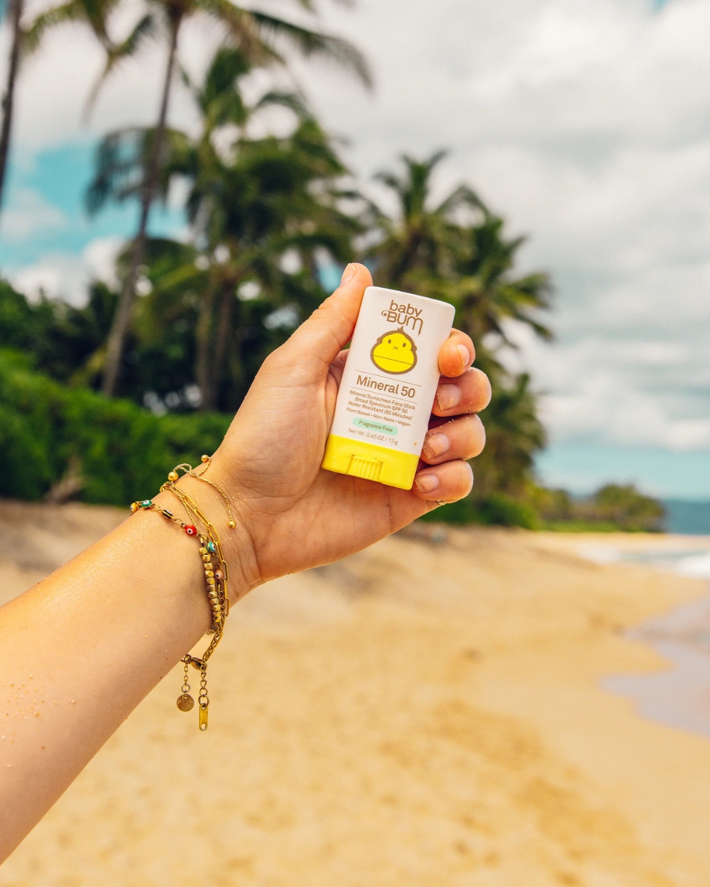 “Sun Bum Baby Bum Mineral SPF 50 Face Stick 13g lifestyle shot with baby items”