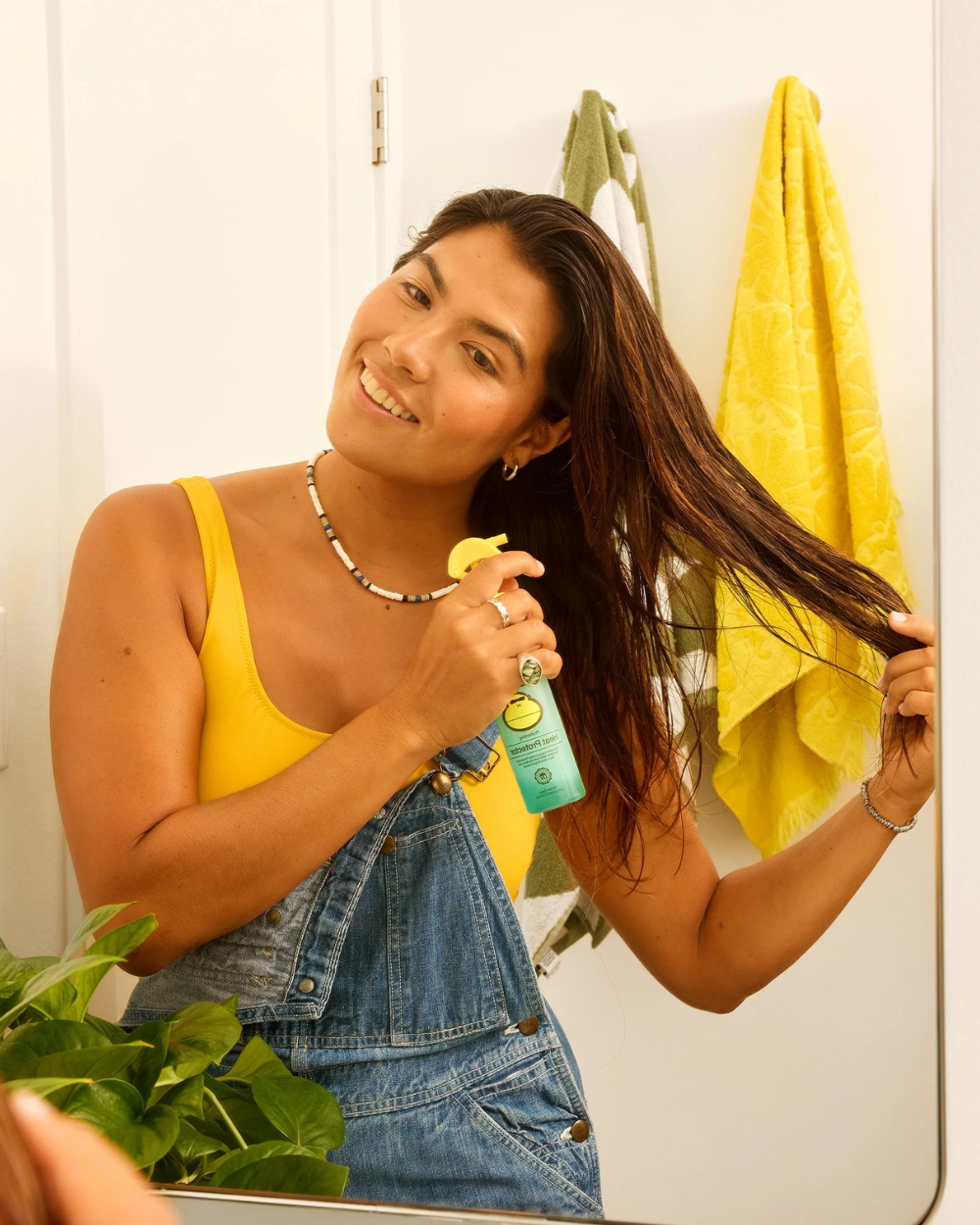 Sun Bum Heat Protector 177mL shown in a beach-inspired lifestyle setting