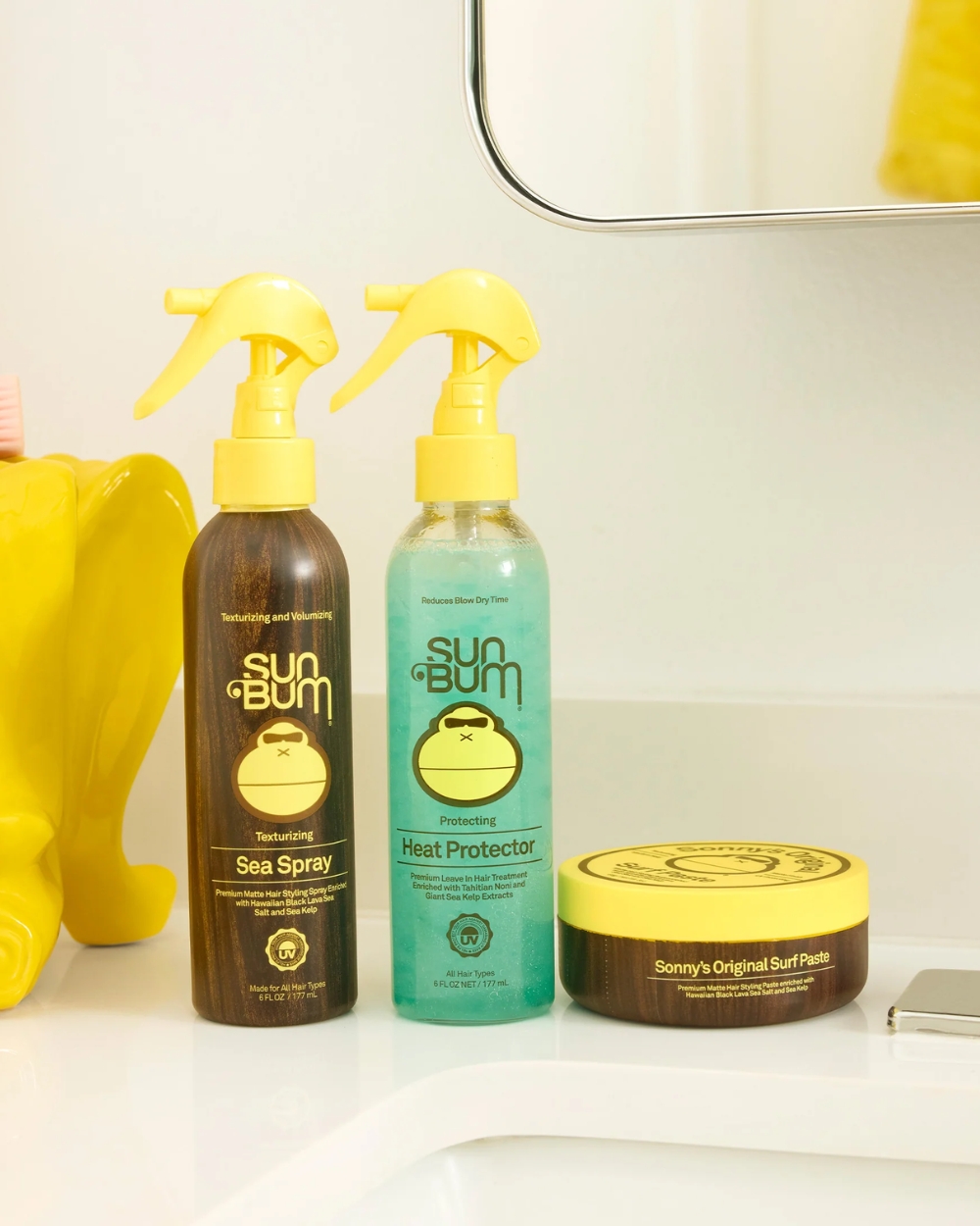 Sun Bum Heat Protector 177mL shown in a beach-inspired lifestyle setting