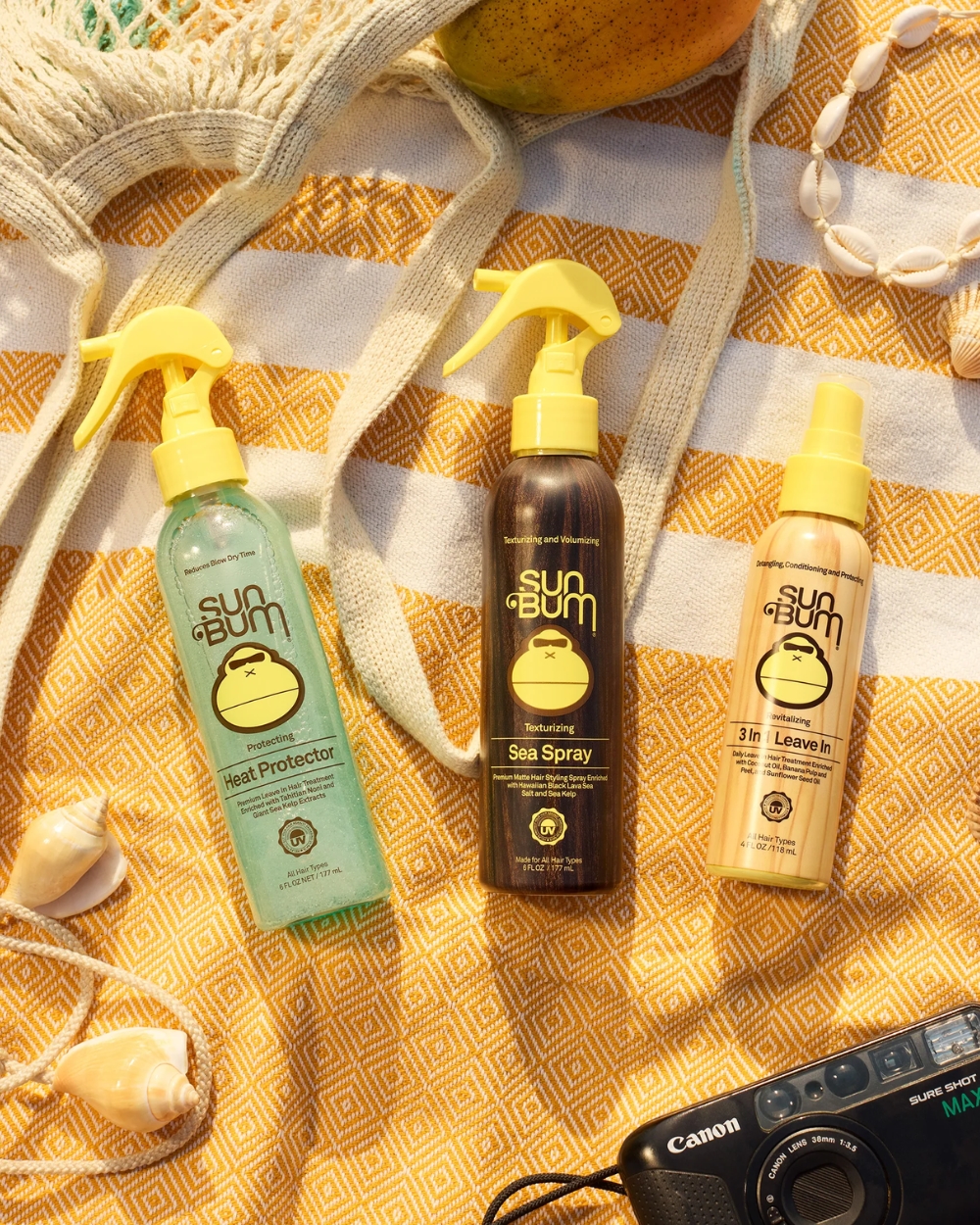 Sun Bum Sea Salt Spray 177ml displayed outdoors in a beach-inspired lifestyle scene